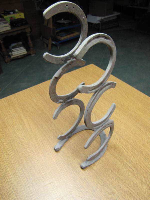 lot 52 image: Horse Shoe Wine Rack