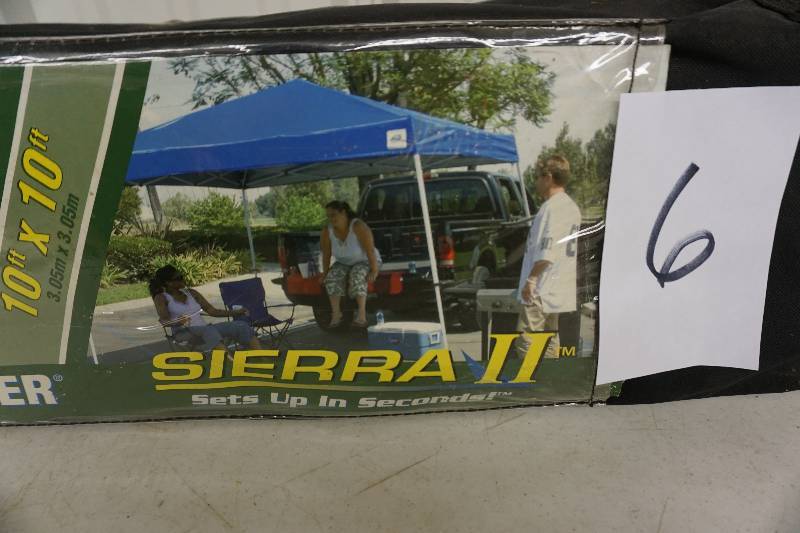 lot 6 image: EZ UP Sierra II 10 x 10 Pop Up Instant Shelter With Wheeled Storage Bag