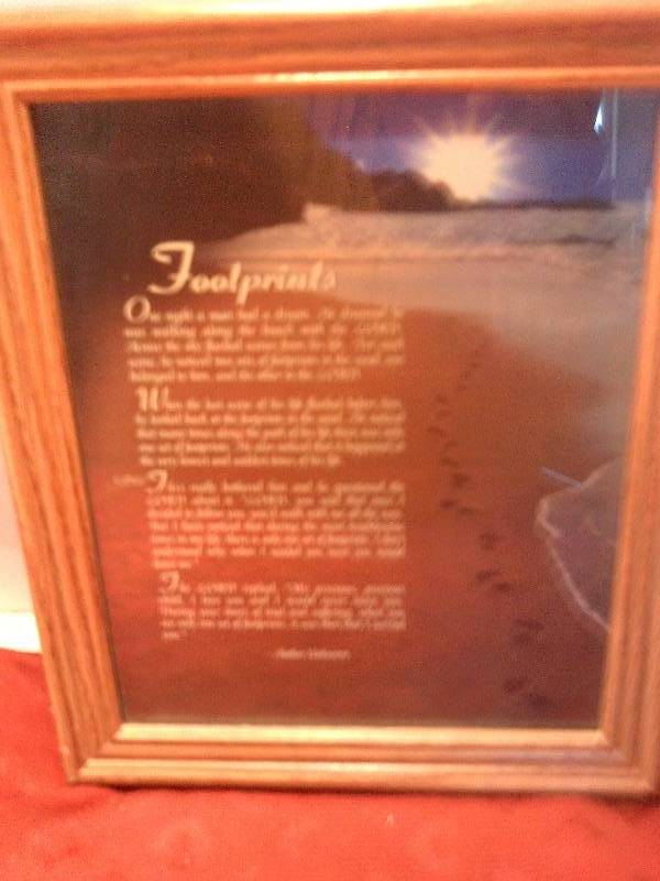 framed foot prints in the sand