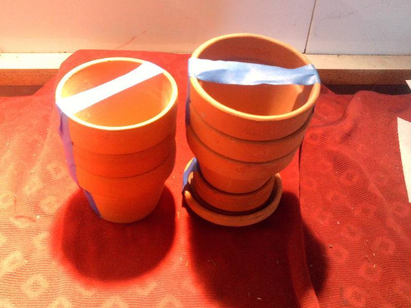 6 smaller clay flower pots
