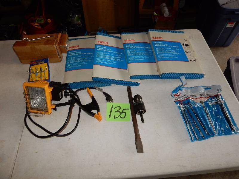 lot 135 image: Misc. items as pictured  4, Mats, 20, 4 in hooks, clip on light (bulb bad),  Hammer Drill bit, Chuck, Partial set of drill bits