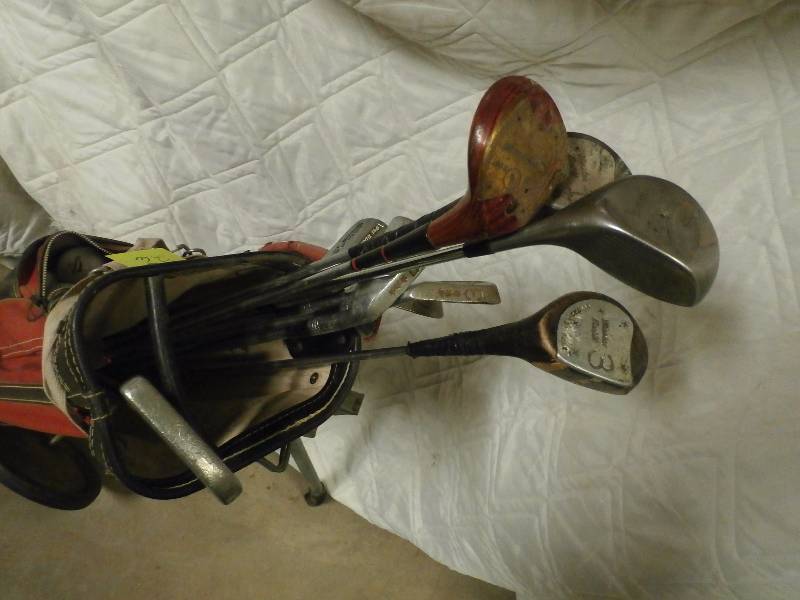golf clubs with hand cart.