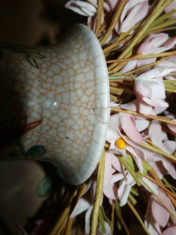 vintage vase with a small chip repaired