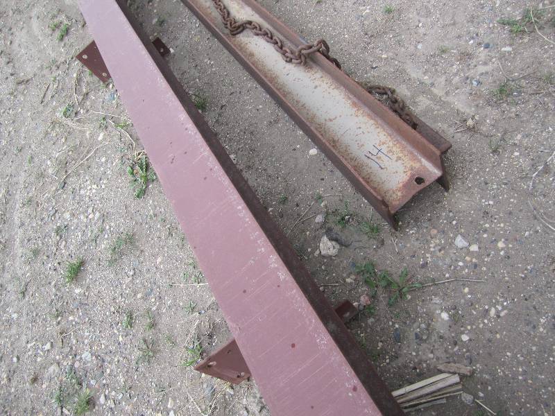 2 Steel I beams, one with a chain ...