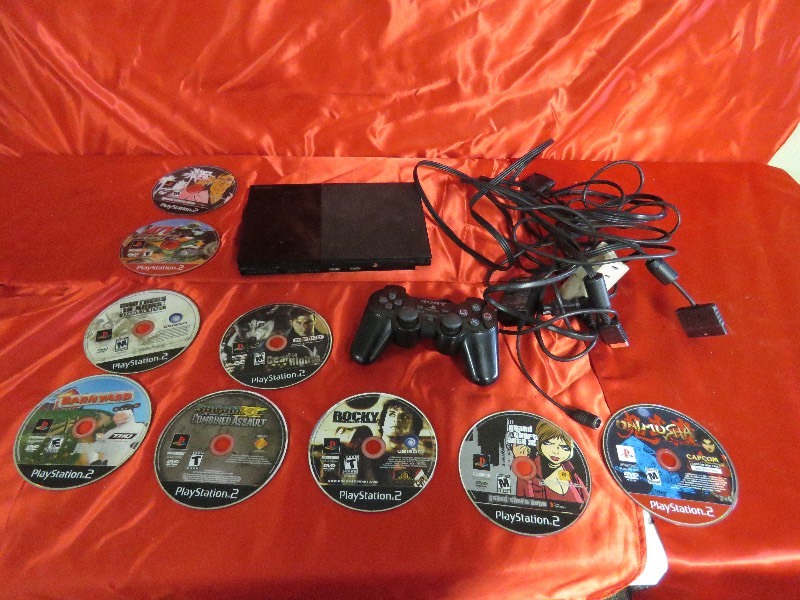 lot 87 image: PS2 with controllers and games