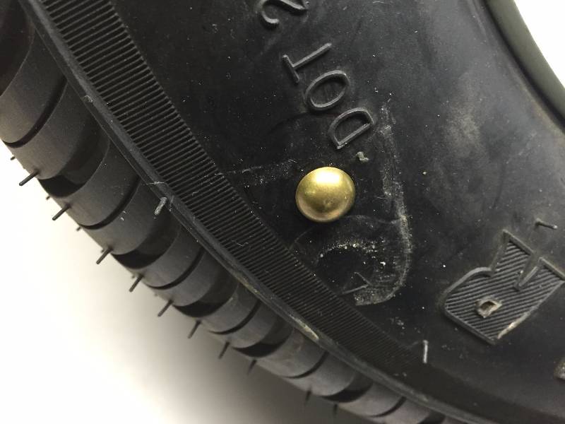 TRAILER TIRE 5 LUG, 20565-10 HAS TACK IN SIDE WALL HOLDS AIR