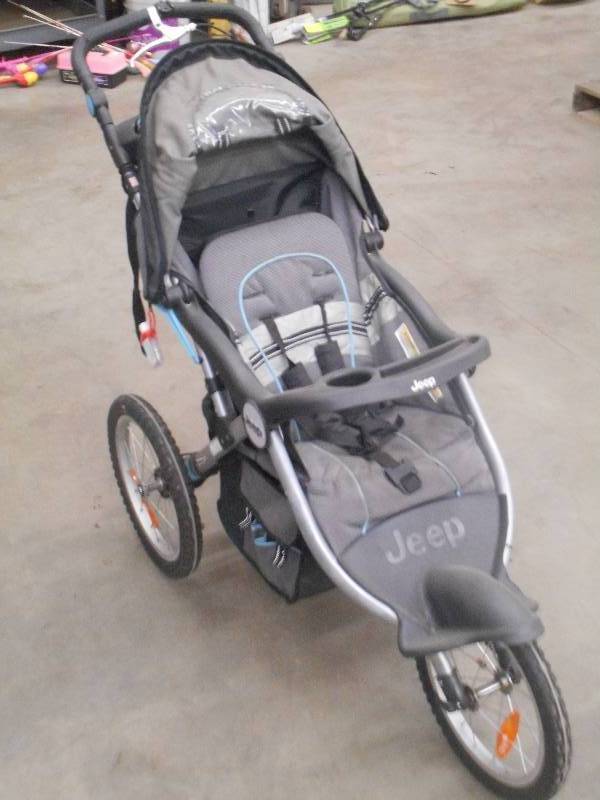 lot 103 image: Jeep Deluxe Foldable Jogging Stroll...