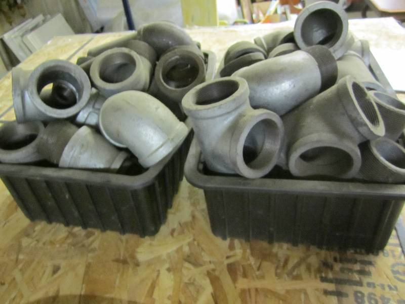 2 plastic tubs of threaded pipe elb...