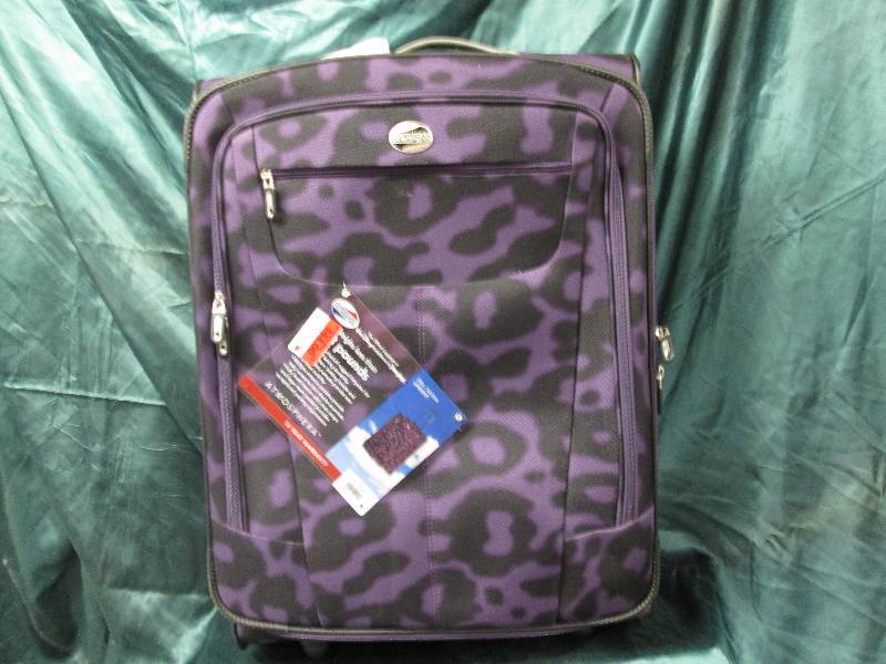 lot 244 image: 25 in upright American Tourister pu...