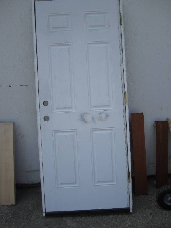 lot 74 image: Exterior steel door, one side is pa...