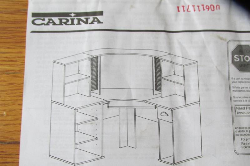 lot 213 image: Carina computer desk, brown laminate surface, all pieces should be included, not assembled or in box