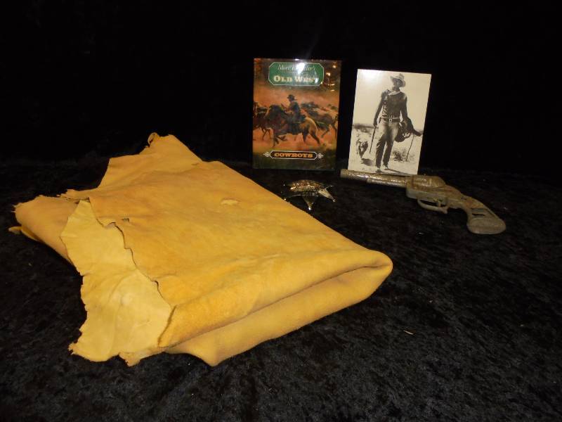 Lot - Deer Hide, Old West Book, Old Cap Gun, Misc