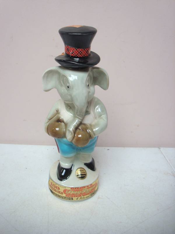 lot 1 image: Vintage Gilbeys Scotch Whiskey Decanter - Elephant
