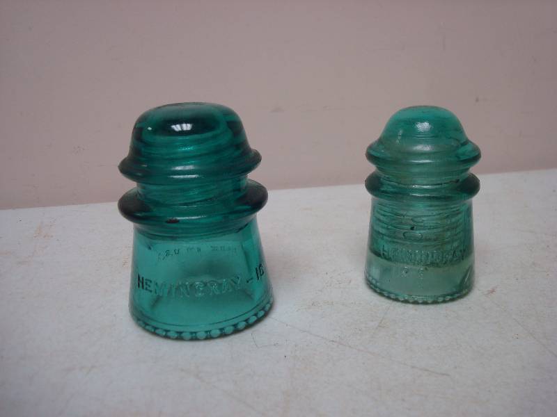 lot 12 image: Pair Of Hemmingway Insulators, One Is Chipped