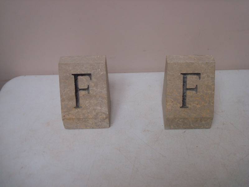 lot 120 image: Pair Of Stones With An F On Them
