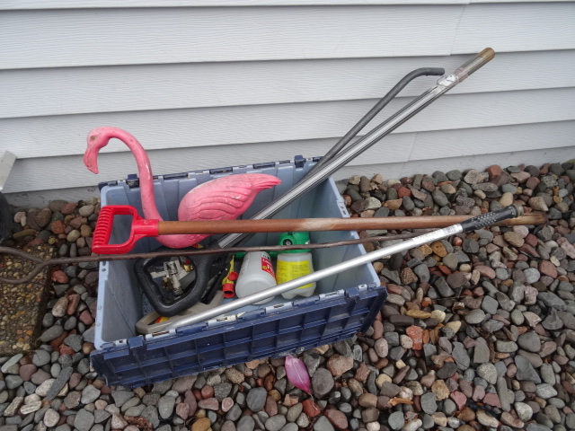 lot 65 image: Bin of Lawn and Garden Supplies.