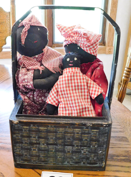 lot 23 image: basket and three cloth black Americana dolls