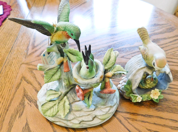 lot 27 image: 2 ceramic bird dcor items both have baby birds in nest
