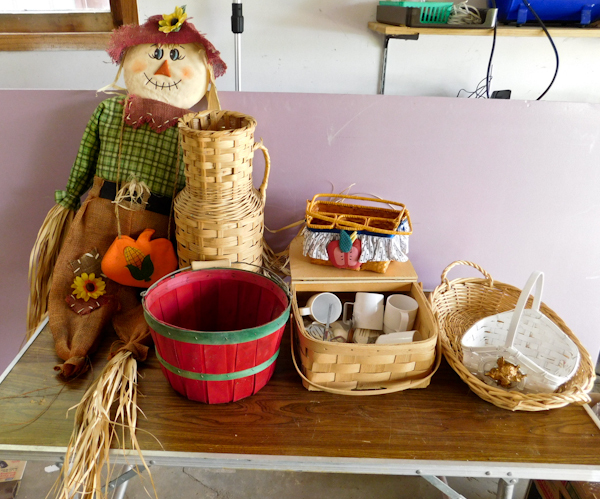 lot 76 image: lot of baskets and scarecrow