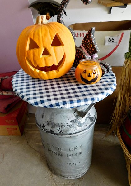 lot 77 image: vintage milkcan with halloween items