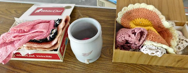 lot 86 image: two cigar boxes of doilies and a mini red wing crock