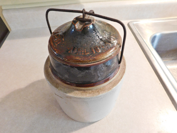 lot 124 image: vintage advertising crock with locking lid