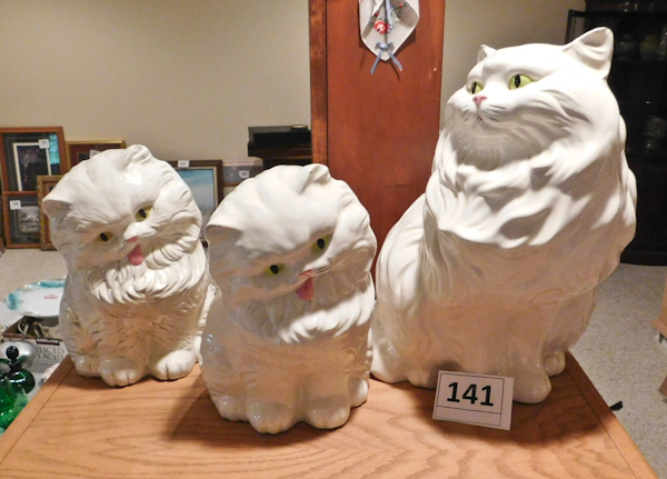lot 141 image: Three ceramic cats
