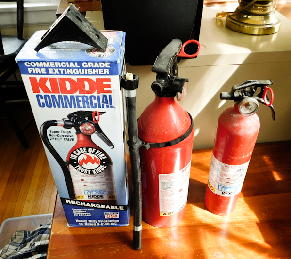 lot 100 image: Kiddie Commercial and household sized fire extinguishers both charged ready to use