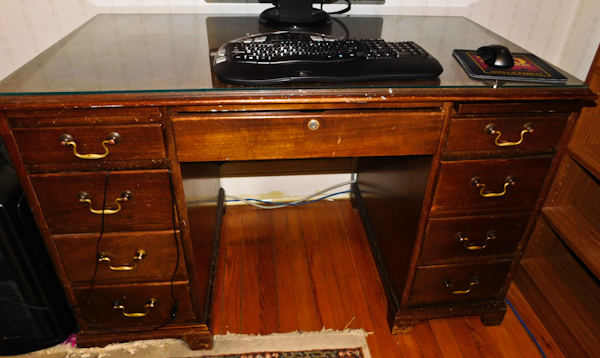 lot 195 image: vintage 9 drawer desk with a glass top
