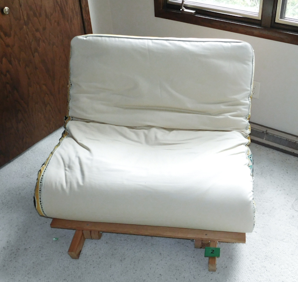 lot 2 image: Futon love seat folds into a twin bed