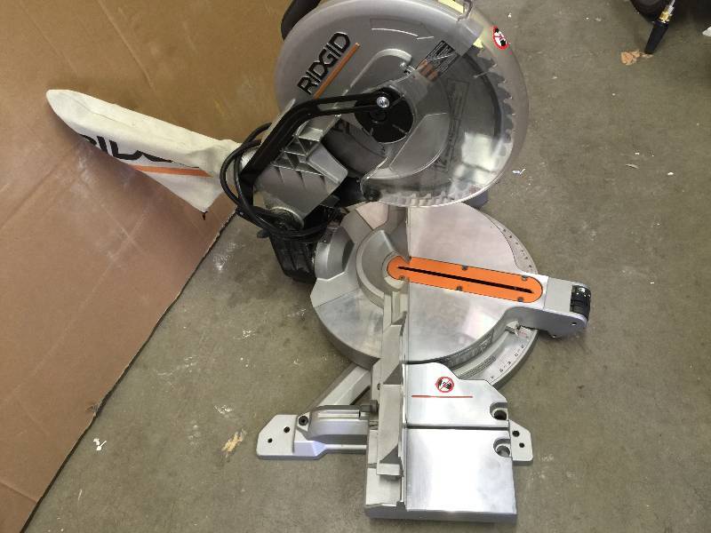 lot 33 image: Ridgid 15-amp 12 in. Compound Miter Saw with Laser Model # R4120 used and like new working conditions