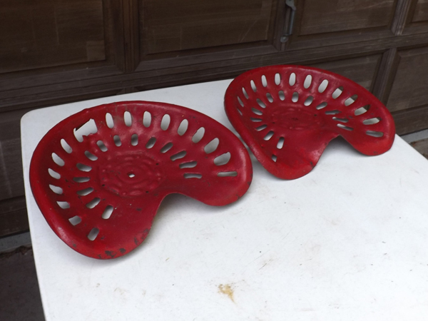 lot 24 image: 2 Antique Iron Tractor Seats