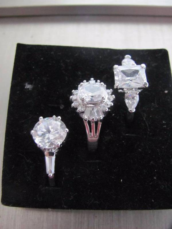 lot 128 image: 3 Pair Dazzling Crystal Solitaire Ring Set Size 8