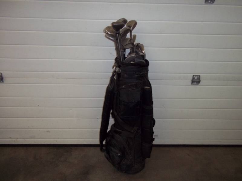 lot 24 image: Golf clubs and bag with cover