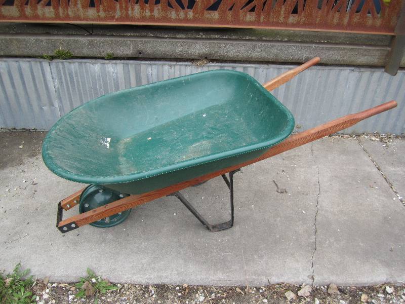 Wheel barrow, has rim but no tire...