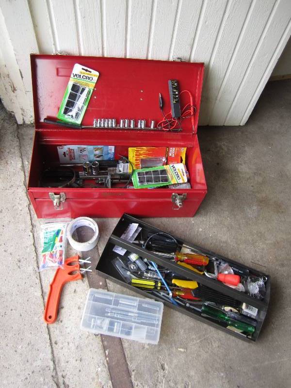red tool box with many tools inside...