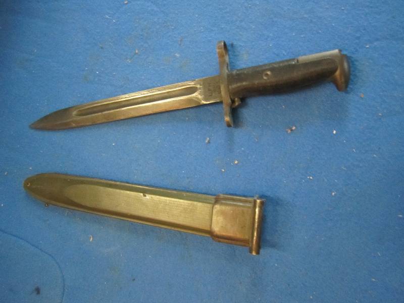 Hunting knife in sheath...