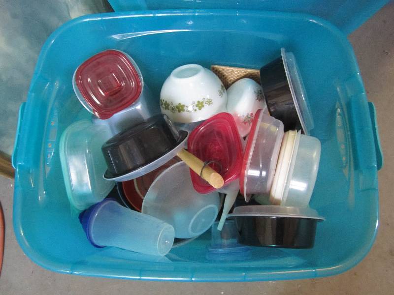 Tote with lid filled with dishes ...