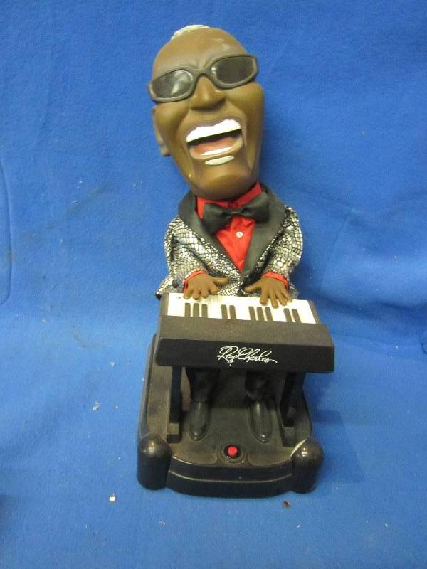Ray Charles figure, plays music but...