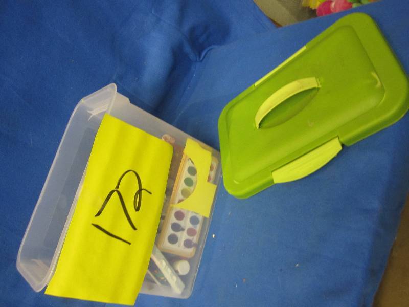 Plastic tote of paint and craft mat...