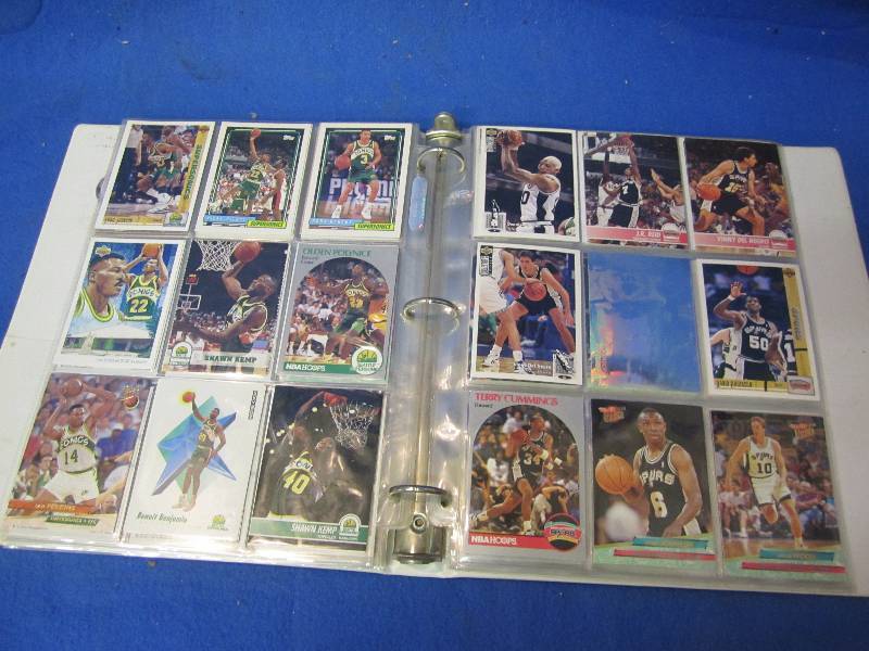 Album filled with sports cards, see...