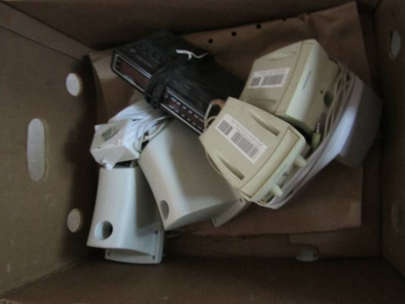 Box of speakers and alarm clock...