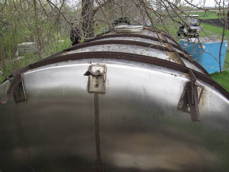 Stainless steel tank, 9 feet across...