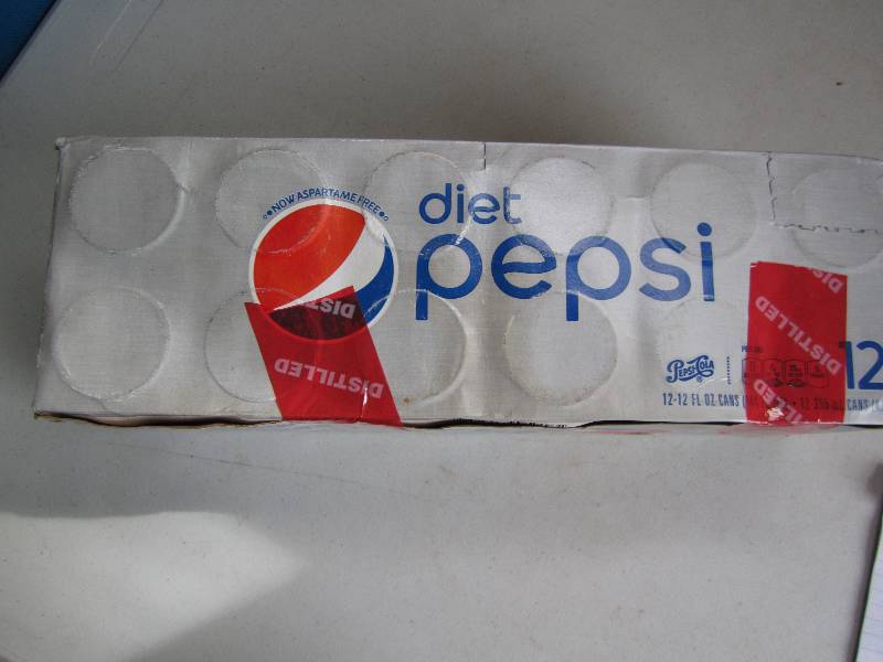 12 pack of pop  soda cans, package...