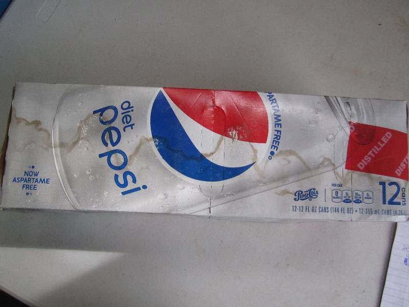 12 pack of pop  soda cans, package...
