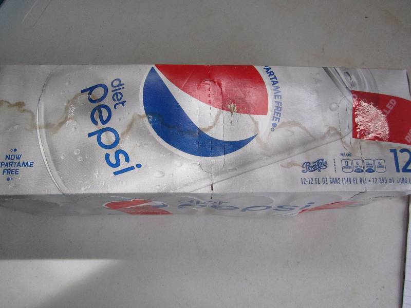 12 pack of pop  soda cans, package...