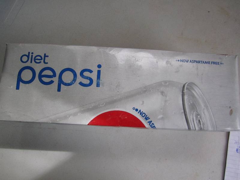 12 pack of pop  soda cans, package...