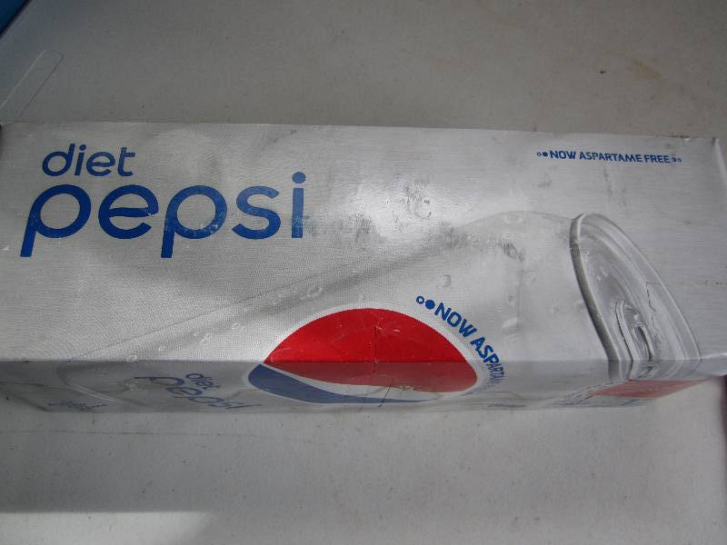 12 pack of pop  soda cans, package...