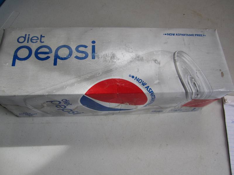 12 pack of pop  soda cans, package...