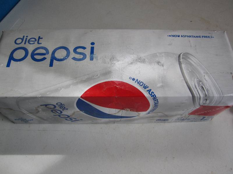 12 pack of pop  soda cans, package...